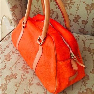 Dooney & Bourke orange pony hair triangle satchel